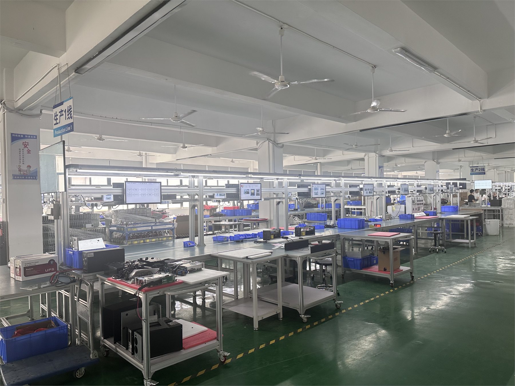 UPS assembly workshop with organized production workstations